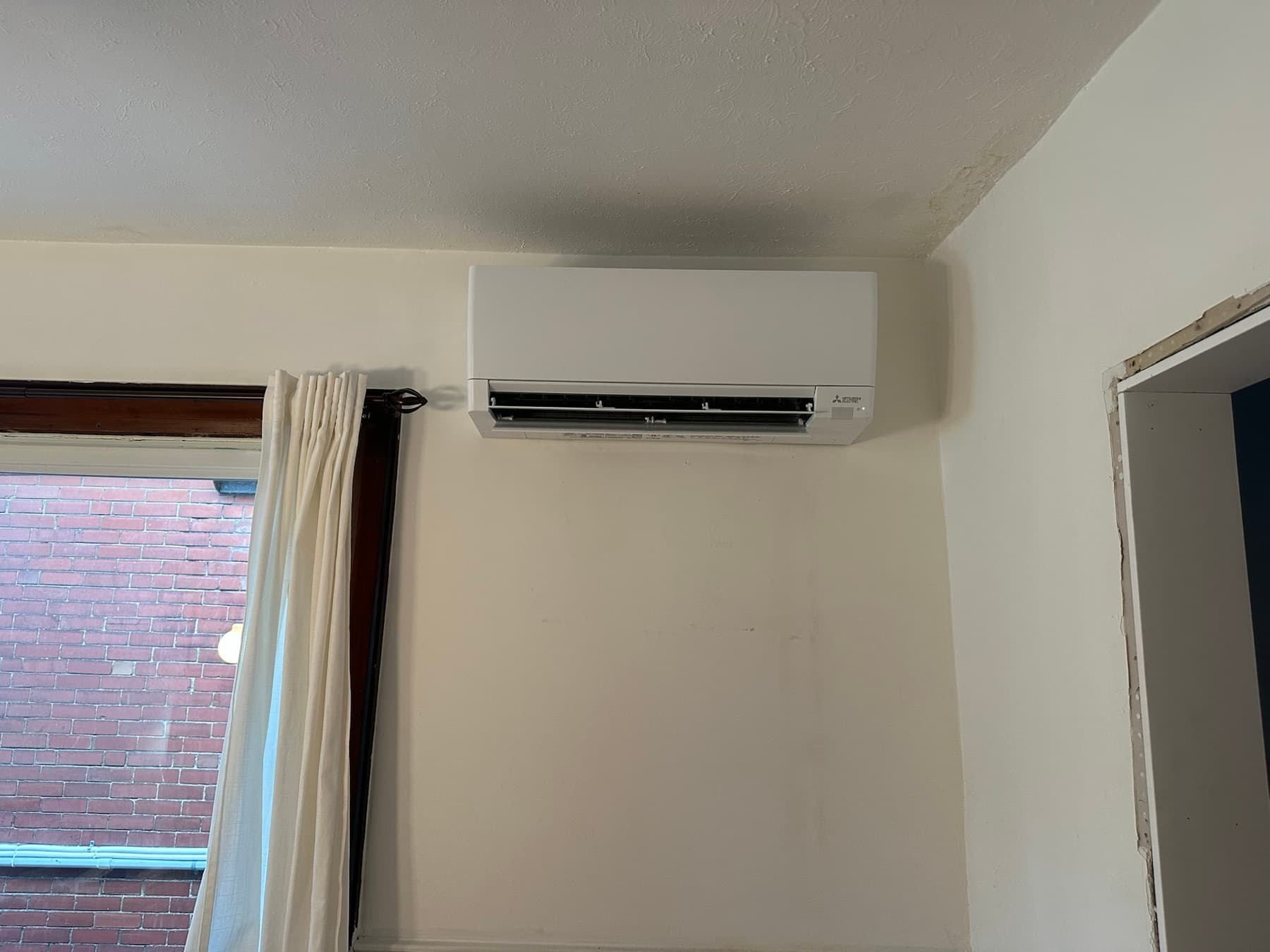 Mitsubishi ductless mini-split installed in a Toronto room